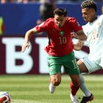 Morocco's forward #10 Brahim Diaz and France's forward #20 Desire Doue fight for the ball during the 2026 World Cup football tournament quarter-final match between France and Morocco at Boston Stadium in Foxborough on July 9, 2026.