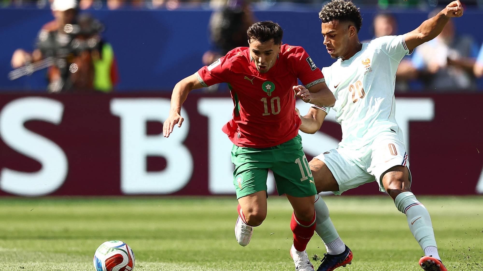 Morocco's forward #10 Brahim Diaz and France's forward #20 Desire Doue fight for the ball during the 2026 World Cup football tournament quarter-final match between France and Morocco at Boston Stadium in Foxborough on July 9, 2026.