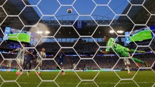 MIAMI GARDENS, FLORIDA - JULY 03: (EDITOR'S NOTE: Image was captured using a remote camera from behind the goal.) Emiliano Martinez #23 of Argentina concedes a second goal to Sidny Lopes Cabral #13 of Cabo Verde during the FIFA World Cup 2026 Round of 32 match between Argentina and Cabo Verde at Miami Stadium on July 03, 2026 in Miami Gardens, Florida. Robert Cianflone/Getty Images/AFP