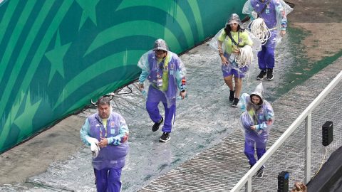 FIFA Volunteers wear raincoats ahead of the 2026 World Cup round of 16 football match between Mexico and England at the Mexico City Stadium in Mexico City on July 5, 2026.