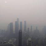 NEW YORK, NY - JULY 16: Smoke from wildfires in Canada shrouds the sun behind Hudson Yards, seen from the 86th-floor observation deck of the Empire State Building on July 16, 2026, in New York City. (Photo by Gary Hershorn/Getty Images)