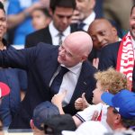 MIAMI GARDENS, FLORIDA - JULY 11: FIFA President Gianni Infantino takes a selfie while Crown Prince Haakon of Norway watches before the FIFA World Cup 2026 Quarter Final match between Norway and England at Miami Stadium on July 11, 2026 in Miami Gardens, Florida. Justin Setterfield/Getty Images/AFP