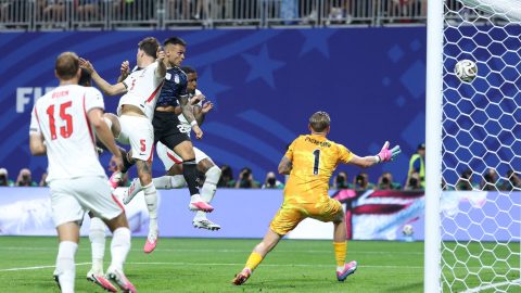 Argentina's forward #22 Lautaro Martinez heads the ball and scores his team's second goal during the 2026 World Cup football tournament semi-final match between England and Argentina at the Atlanta Stadium in Atlanta on July 15, 2026.