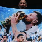 An Argentine fan displays a towel depicting Argentine football player Lionel Messi ahead of the 2026 World Cup round of 32 football match between Argentina and Cape Verde at the Miami Stadium in Miami Gardens on July 3, 2026.