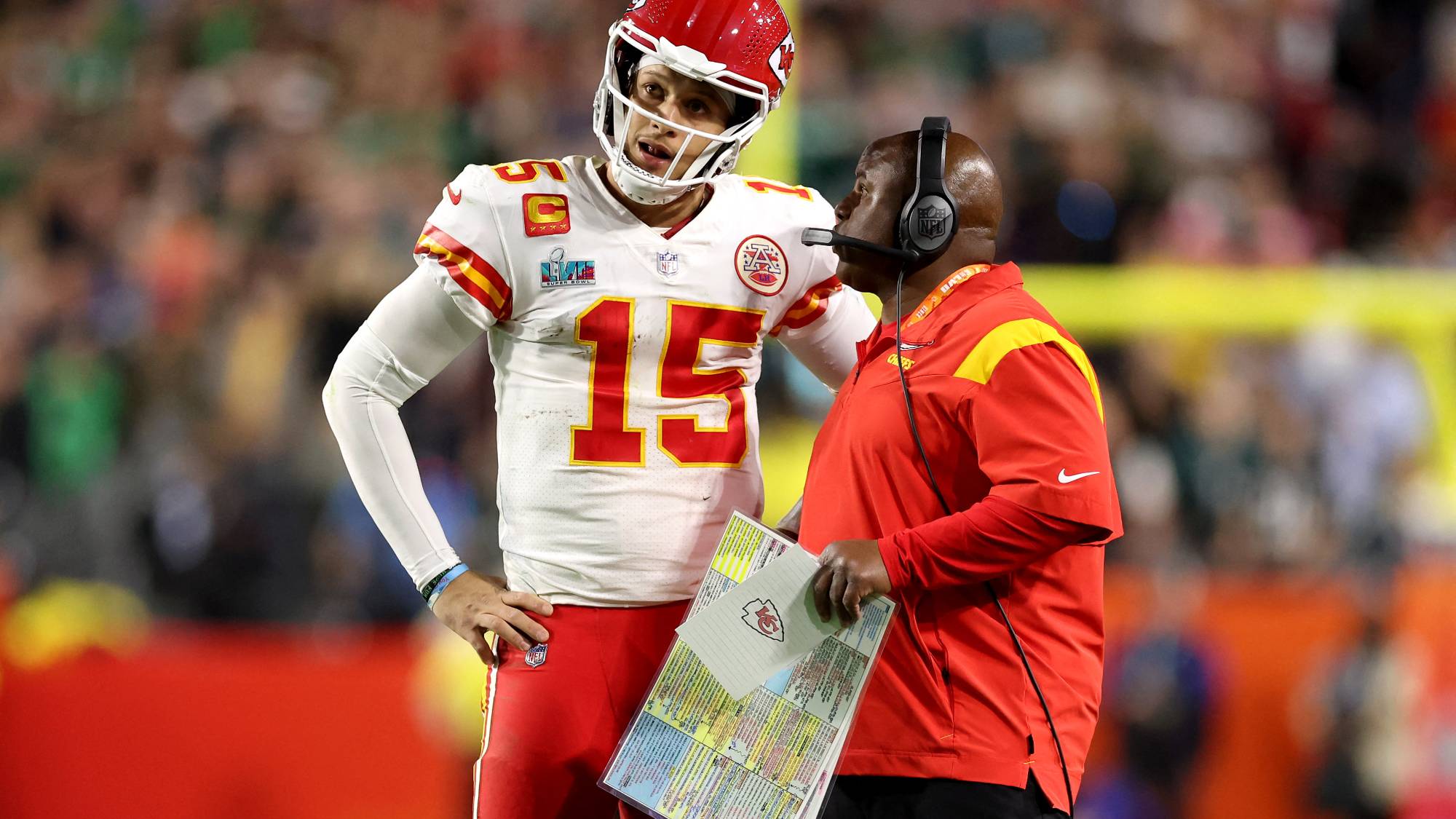GLENDALE, ARIZONA - FEBRUARY 12: Patrick Mahomes #15 of the Kansas City Chiefs talks with offensive coordinator Eric Bieniemy during the fourth quarter against the Philadelphia Eagles in Super Bowl LVII at State Farm Stadium on February 12, 2023 in Glendale, Arizona. Christian Petersen/Getty Images/AFP