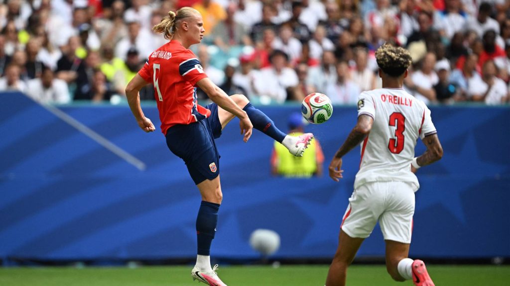 Norway's forward #09 Erling Braut Haaland kicks the ball past England's defender #03 Nico O'Reilly during the 2026 World Cup football tournament quarter-final match between Norway and England at Miami Stadium in Miami Gardens on July 11, 2026.
