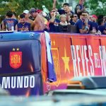 Spain's players parade onboard an open-top bus through the streets of Madrid on July 20, 2026, one day after the national football team won their second World Cup title following a 1-0 victory against Argentina. Spain's World Cup winners come back home to a heroes' welcome in Madrid, where a million fans are expected to greet them after a night of raucous celebrations across the country.