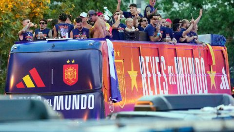 Spain's players parade onboard an open-top bus through the streets of Madrid on July 20, 2026, one day after the national football team won their second World Cup title following a 1-0 victory against Argentina. Spain's World Cup winners come back home to a heroes' welcome in Madrid, where a million fans are expected to greet them after a night of raucous celebrations across the country.