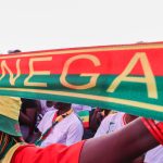 DAKAR, SENEGAL- JULY 02: Thousands of fans gather at Place de la Nation Square to watch the match on a giant screen, holding Senegal flags and wearing national team jerseys in Dakar, Senegal, on July 02, 2026. Cem Ozdel / Anadolu