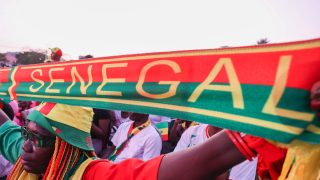 DAKAR, SENEGAL- JULY 02: Thousands of fans gather at Place de la Nation Square to watch the match on a giant screen, holding Senegal flags and wearing national team jerseys in Dakar, Senegal, on July 02, 2026. Cem Ozdel / Anadolu