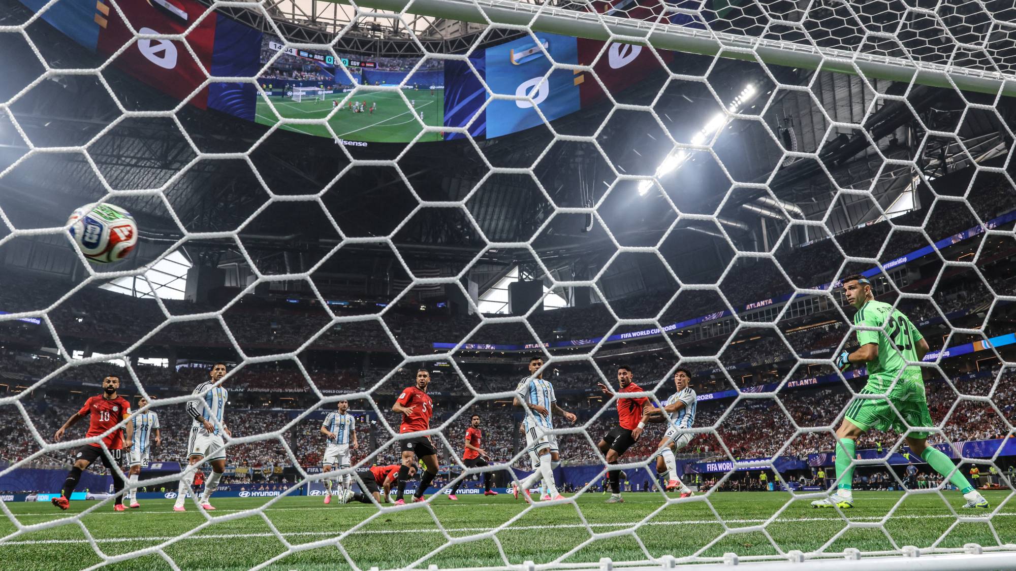 Egypt's defender #02 Yasser Ibrahim (3rd R) scores his team's first goal during the 2026 World Cup round of 16 football match between Argentina and Egypt at Atlanta Stadium in Atlanta on July 7, 2026.