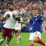 ARLINGTON, TEXAS - JULY 14: Lamine Yamal #19 of Spain is fouled in the box for a penalty by Lucas Digne #3 of France during the FIFA World Cup 2026 Semi Final match between France and Spain at Dallas Stadium on July 14, 2026 in Arlington, Texas. Shaun Botterill/Getty Images/AFP