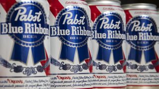 NEW YORK, NEW YORK - NOVEMBER 15: In this photo illustration, cans of Pabst Blue Ribbon beer sit on a table, November 15, 2018 in New York City. Pabst Brewing Company has filed a lawsuit against MillerCoors. Pabst claims that MillerCoors wants to put them out of business by ending a partnership where MillerCoors brews Pabsts beers, a practice known as contract brewing. The trial began on Monday and is set to run through Nov. 30th at the Milwaukee County Circuit Court. (Photo Illustration by Drew Angerer/Getty Images) (Photo by Drew Angerer / GETTY IMAGES NORTH AMERICA / Getty Images via AFP)