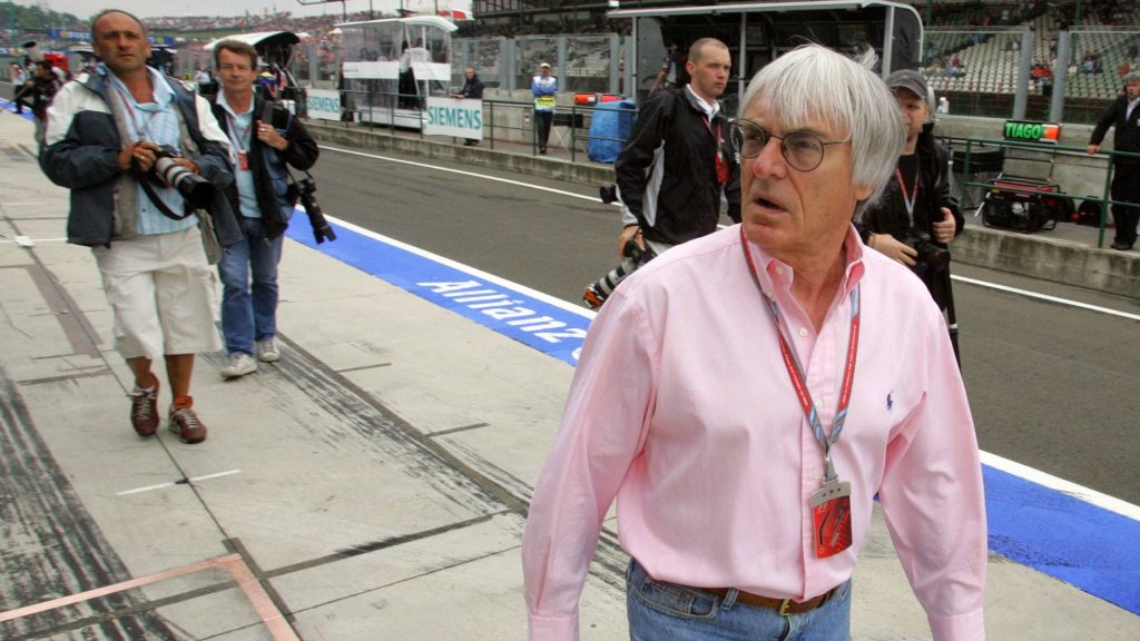 British President of the Formula One Organisation Administration Bernie Ecclestone walks in the pits of the Hungaroring racetrack, 04 August 2006 in Budapest, during the first practice session of the Hungarian Grand Prix. AFP PHOTO DAMIEN MEYER