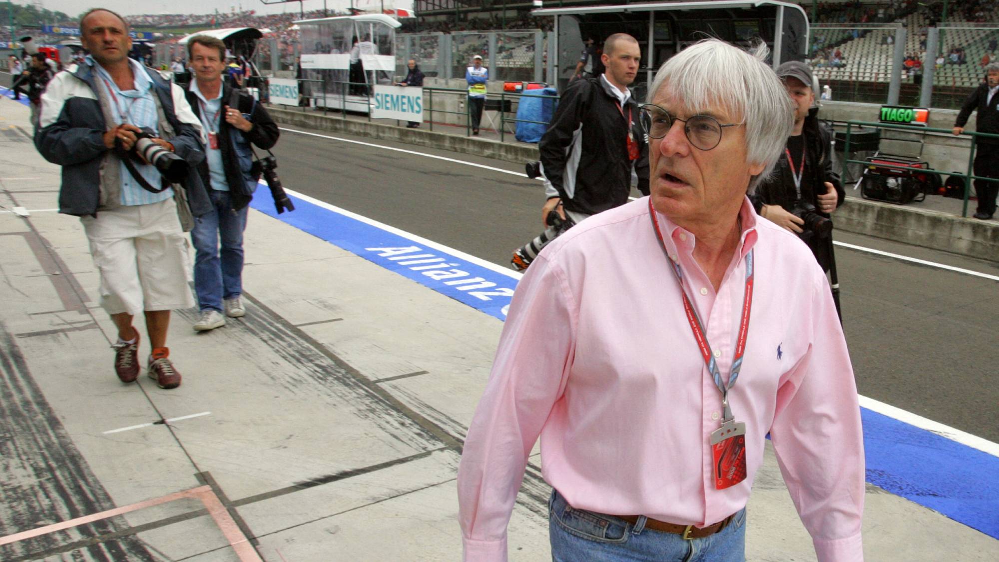 British President of the Formula One Organisation Administration Bernie Ecclestone walks in the pits of the Hungaroring racetrack, 04 August 2006 in Budapest, during the first practice session of the Hungarian Grand Prix. AFP PHOTO DAMIEN MEYER