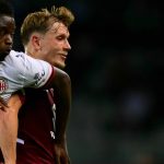 AC Milan’s Italian midfielder #70 Alphadjo Cisse (L) fights for the ball with Torino’s Norwegian defender #16 Marcus Pedersen (R) during the Italian Serie A football match between Torino FC and AC Milan at the Olympic Stadium Grande Torino in Turin, northern Italy on August 23, 2026.