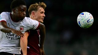 AC Milan’s Italian midfielder #70 Alphadjo Cisse (L) fights for the ball with Torino’s Norwegian defender #16 Marcus Pedersen (R) during the Italian Serie A football match between Torino FC and AC Milan at the Olympic Stadium Grande Torino in Turin, northern Italy on August 23, 2026.