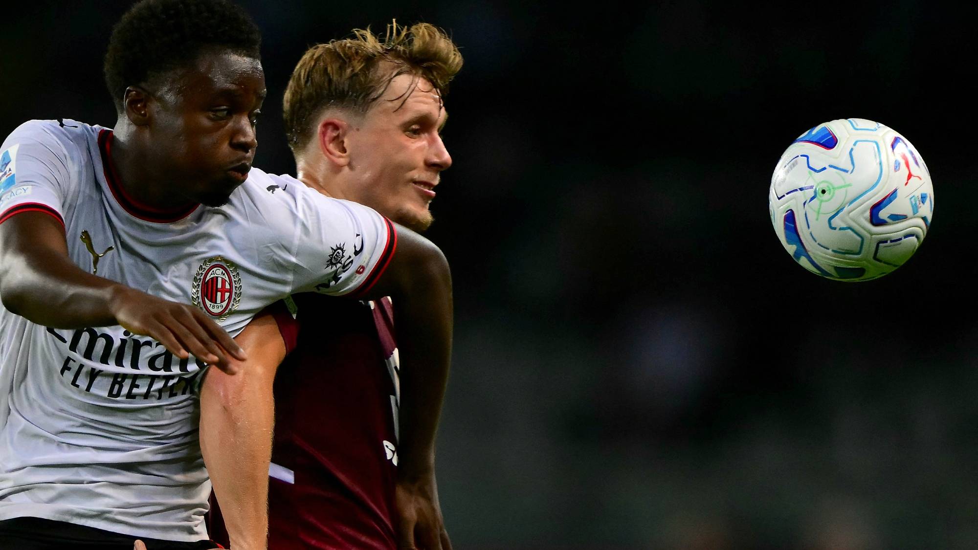 AC Milan’s Italian midfielder #70 Alphadjo Cisse (L) fights for the ball with Torino’s Norwegian defender #16 Marcus Pedersen (R) during the Italian Serie A football match between Torino FC and AC Milan at the Olympic Stadium Grande Torino in Turin, northern Italy on August 23, 2026.