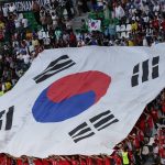 A large South Korean flag is displayed in the crown by supporters during the Qatar 2022 World Cup Group H football match between Uruguay and South Korea at the Education City Stadium in Al-Rayyan, west of Doha on November 24, 2022.