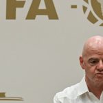 FIFA President Gianni Infantino gestures during his visit to the new Concentration Hotel of the Colombian Football Federation in Barranquilla, Colombia, on February 24, 2026. FIFA president Gianni Infantino came under renewed fire on August 10, 2026 as a joint letter from three confederations -- UEFA, CONCACAF and AFC -- declared football "belongs to no individual".