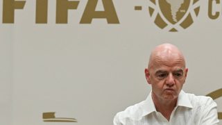 FIFA President Gianni Infantino gestures during his visit to the new Concentration Hotel of the Colombian Football Federation in Barranquilla, Colombia, on February 24, 2026. FIFA president Gianni Infantino came under renewed fire on August 10, 2026 as a joint letter from three confederations -- UEFA, CONCACAF and AFC -- declared football "belongs to no individual".