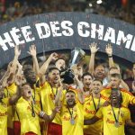 Lens' players celebrate with the championship trophy after winning the French Super Cup (Trophee des Champions) football match between RC Lens and Paris Saint-Germain (PSG) at the Stade Bollaert-Delelis in Lens, northern France on August 16, 2026.