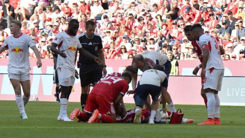 15.08.2026, Allianz Arena, Munich, Test match, FC FC Bayern Munich vs RB Leipzig , Jamal Musiala (Munich) collapses on the field, needs treatment, Ismael Saibari (Munich) holds his head. DFL regulations prohibit any use of photographs as image sequence