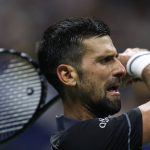 NEW YORK, NEW YORK - AUGUST 30: Novak Djokovic of Serbia returns a shot in his match against Mariano Navone of Argentina during their Men's Singles First Round match on Day One of the 2026 US Open at USTA Billie Jean King National Tennis Center on August 30, 2026 in the Flushing neighborhood of the Queens borough of New York City. Julian Finney/Getty Images/AFP