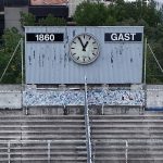 Aerial view of Gruenwalder Stadium, empty North stands, the Sechzger fans [supporters], football fans, stands with scoreboard and clock. The facility is located in the Giesing district in the capital city Munich and is the home ground of the football club