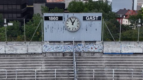 Aerial view of Gruenwalder Stadium, empty North stands, the Sechzger fans [supporters], football fans, stands with scoreboard and clock. The facility is located in the Giesing district in the capital city Munich and is the home ground of the football club