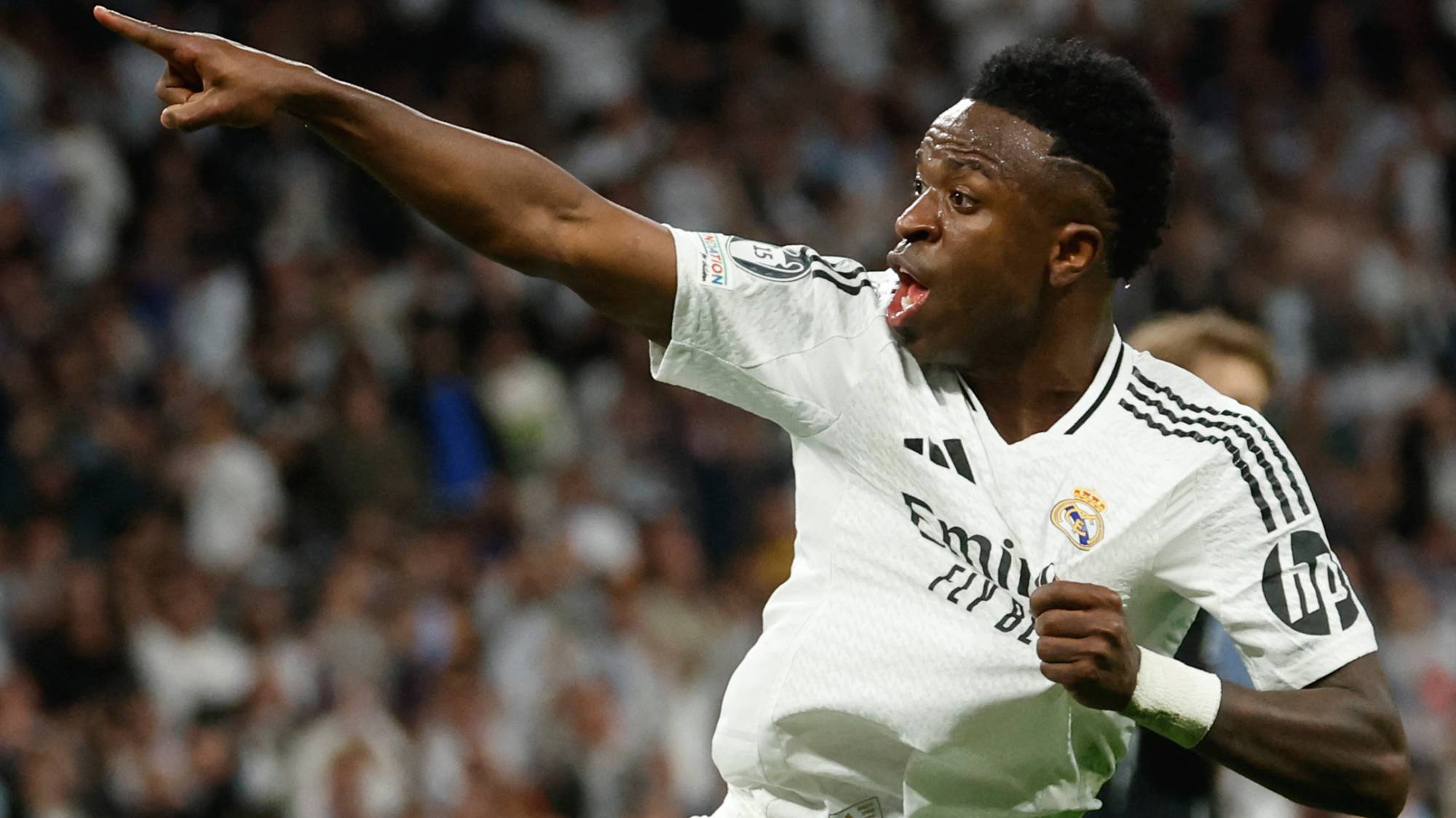 Real Madrid's Brazilian forward #07 Vinicius Junior celebrates scoring his team's first goal during the UEFA Champions League quarter final second leg football match between Real Madrid CF and Arsenal at Santiago Bernabeu Stadium in Madrid on April 16, 2025. Star forward Vinicius Junior has extended his contract with Real Madrid to 2032, the club announced on August 6, 2026, quelling speculation about his future that had linked him with Arsenal. "Real Madrid FC and Vinicius Jr have agreed the extension of the contract of our player, who is tied to the club until June 30, 2032," Los Blancos said in a statement.