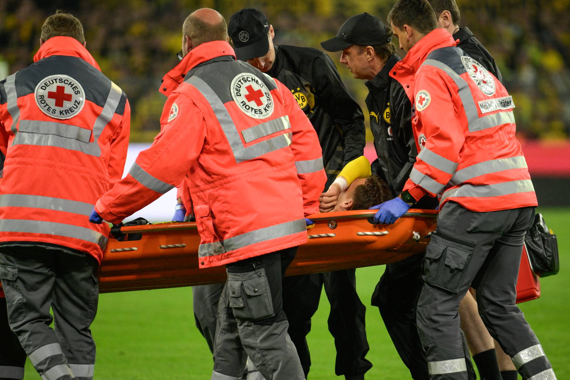 Borussia Dortmund's Greek midfielder #19 Konstantinos Karetsas is carried off the pitch on a stretcher after injury during the UEFA Champions League - League phase, Matchday 1 - football match between BVB Borussia Dortmund and Villarreal CF in Dortmund, western Germany, on September 8, 2026.