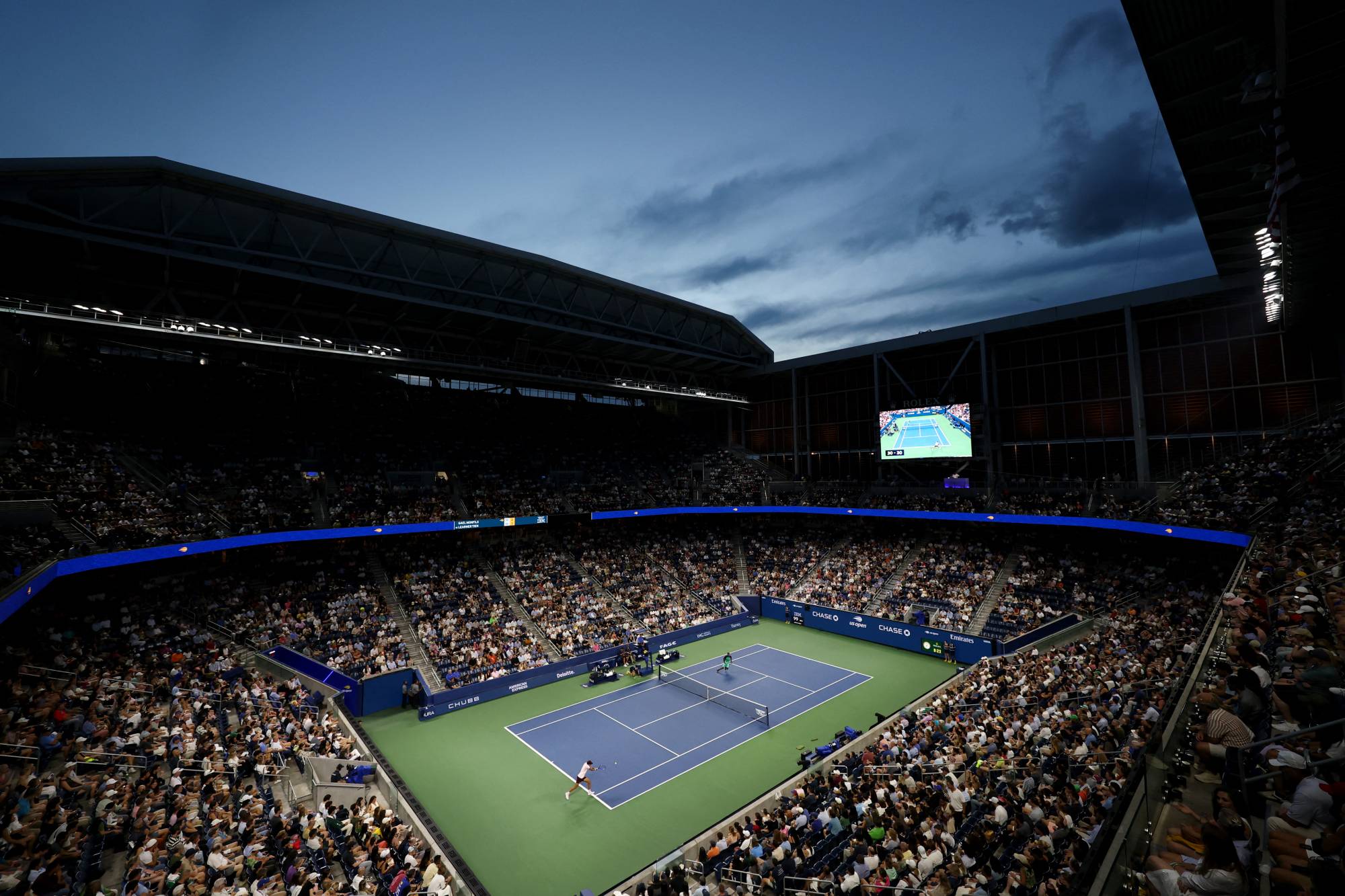 NEW YORK, NEW YORK - SEPTEMBER 03: A general view of Louis Armstrong Stadium as Learner Tien of the United States returns a shot against Gael Monfils of France during their Men's Singles Second Round match on Day Five of the 2026 US Open at USTA Billie Jean King National Tennis Center on September 03, 2026 in the Flushing neighborhood of the Queens borough of New York City. Julian Finney/Getty Images/AFP
