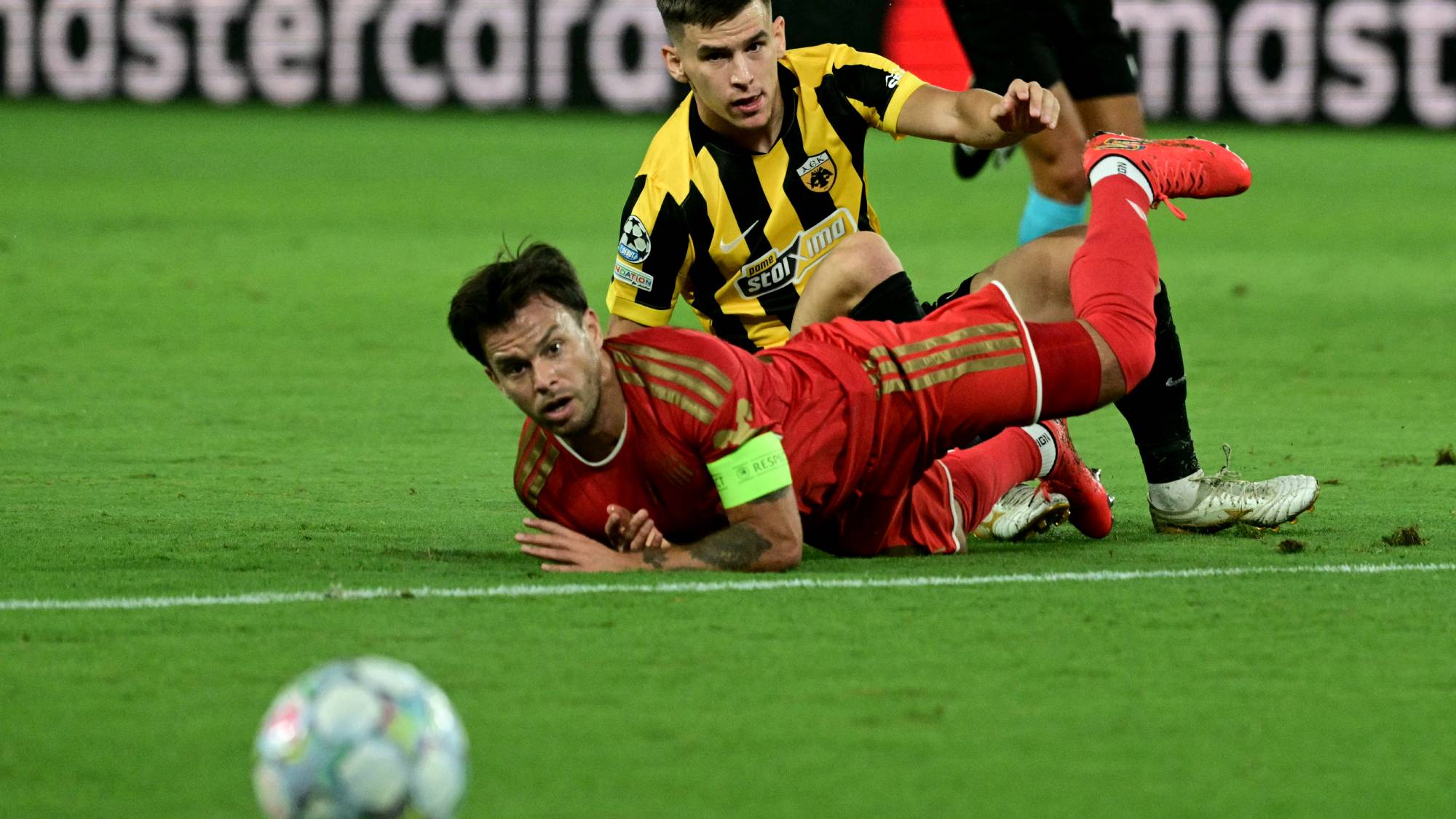 LASK's Austrian midfielder #30 Sascha Horvath (L) and AEK Athens' Hungarian midfielder #27 Milan Vitalis eye the ball during the UEFA Champions League - League phase, Matchday 1 - football match between AEK Athens and LASK at Agia Sophia Stadium in Athens on September 8, 2026.