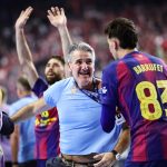 FC Barcelona's Spanish headcoach Antonio Carlos Ortega Perez (C) and his players celebrate after the EHF Men's Handball Champions League Final 4 final between Barca and Fuechse Berlin in Cologne, western Germany on June 14, 2026. Barca won the match 37:34.