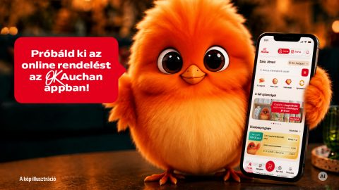 Fluffy orange chick holding a smartphone showing the Auchan app; a red speech bubble reads, 'Próbáld ki az online rendelést az Auchan appban!'