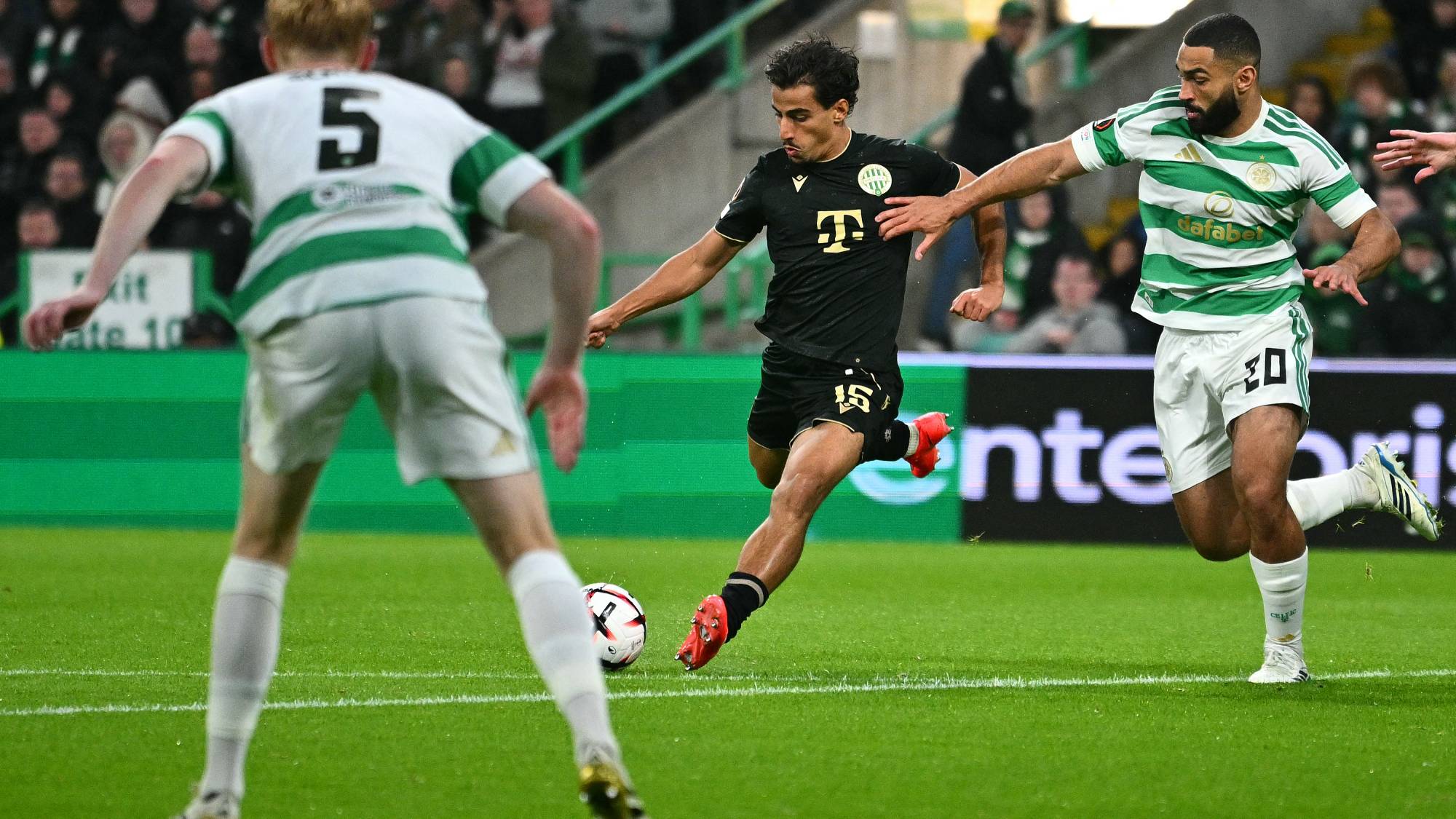 Ferencvaros' Australian midfielder #15 Daniel Arzani (C) scores the team's third goal during the UEFA Europa League, League phase football match between Celtic and Ferencvaros at Celtic Park in Glasgow on September 17, 2026.