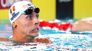 Romania's David Popovici reacts after winning the final of the men's 200m freestyle swimming event during the LEN European Aquatics Championships at the Olympic Aquatic Centre in Saint-Denis, northern suburbs of Paris, on August 14, 2026.