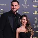 Paris Saint-Germain's Italian goalkeeper Gianluigi Donnarumma (L) and his partner Alessia Elefante pose upon arrival to attend the 2021 Ballon d'Or France Football award ceremony at the Theatre du Chatelet in Paris on November 29, 2021.