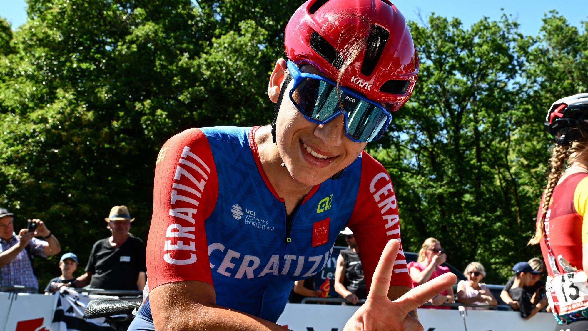 Ceratizit Pro Cycling's Afghan rider Fariba Hashimi flashes the V-sign after winning the women’s Elite race of the Afghan National Road Cycling championships organised in Les Herbiers, western France, on June 28, 2025.