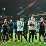 Ferencvaros' Norwegian midfielder #16 Kristoffer Zachariassen (R) and teammates applaud the fans following the UEFA Europa League, League phase football match between Celtic and Ferencvaros at Celtic Park in Glasgow on September 17, 2026.