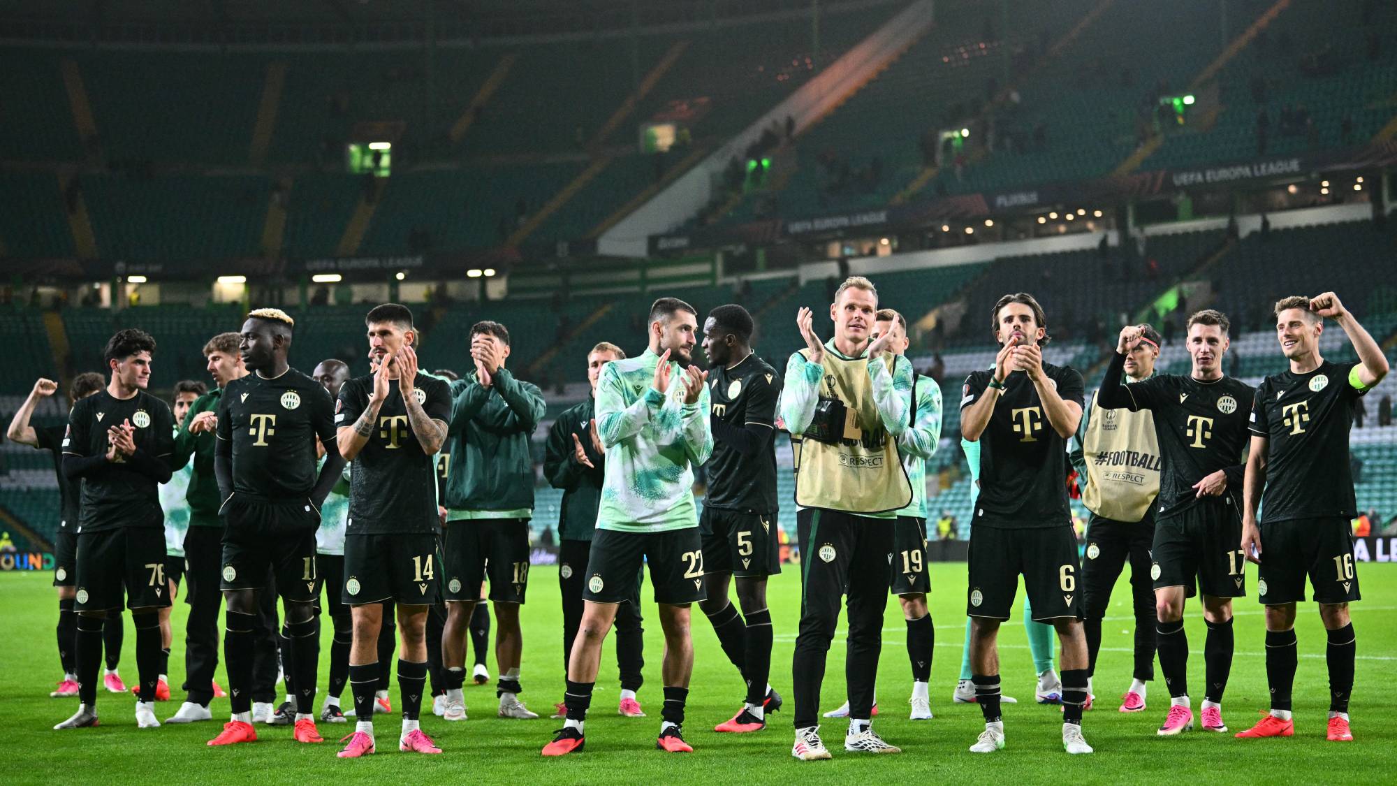Ferencvaros' Norwegian midfielder #16 Kristoffer Zachariassen (R) and teammates applaud the fans following the UEFA Europa League, League phase football match between Celtic and Ferencvaros at Celtic Park in Glasgow on September 17, 2026.