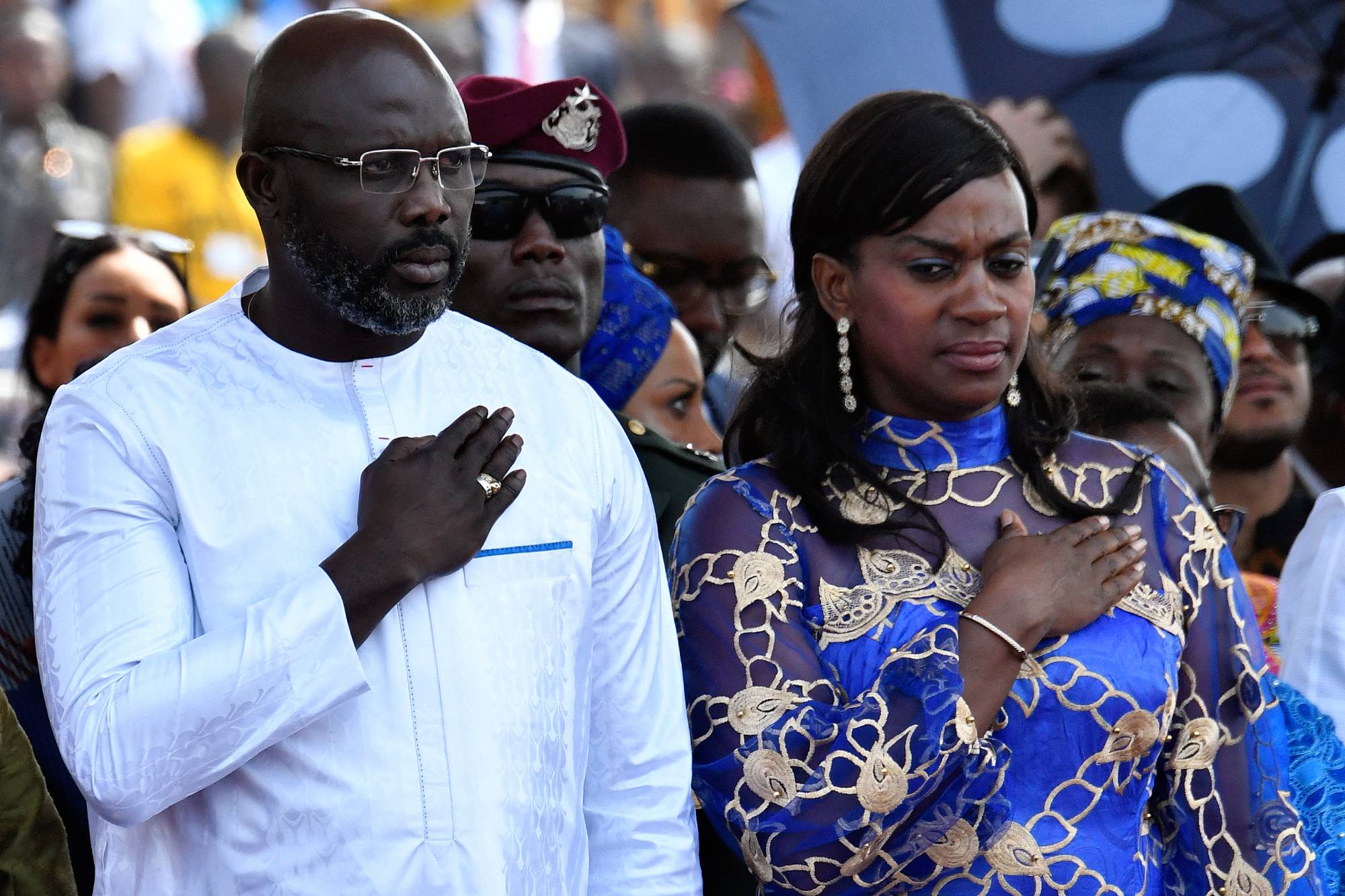 Liberia's president-elect and former football star George Weah (L) and his wife Clar Weah attend his swearing-in ceremony on January 22, 2018 in Monrovia. To the cheers of a crowd fired by his promise to bring them jobs and prosperity, former football star George Weah was sworn in as president of Liberia on January 22, completing the country's first transition between democratically-elected leaders since 1944.