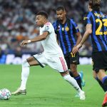 Real Madrid's French forward #10 Kylian Mbappe (L) runs with the ball past Inter Milan's Italian midfielder #23 Nicolo Barella (R) and Inter Milan's French midfielder #17 Andy Diouf during the UEFA Champions League first round day 1 football match between Real Madrid and Inter Milan at the Santiago Bernabeu stadium in Madrid on September 8, 2026.