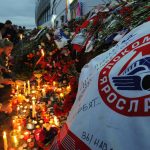 People lay flowers in front of the Arena-2000, the home venue of the Lokomotiv Yaroslav team, in Yaroslavl, on September 8, 2011, in honor of the members of the team who were among the 43 people killed in a plane crash on September 7. AFP PHOTO/ ALEXANDER NEMENOV