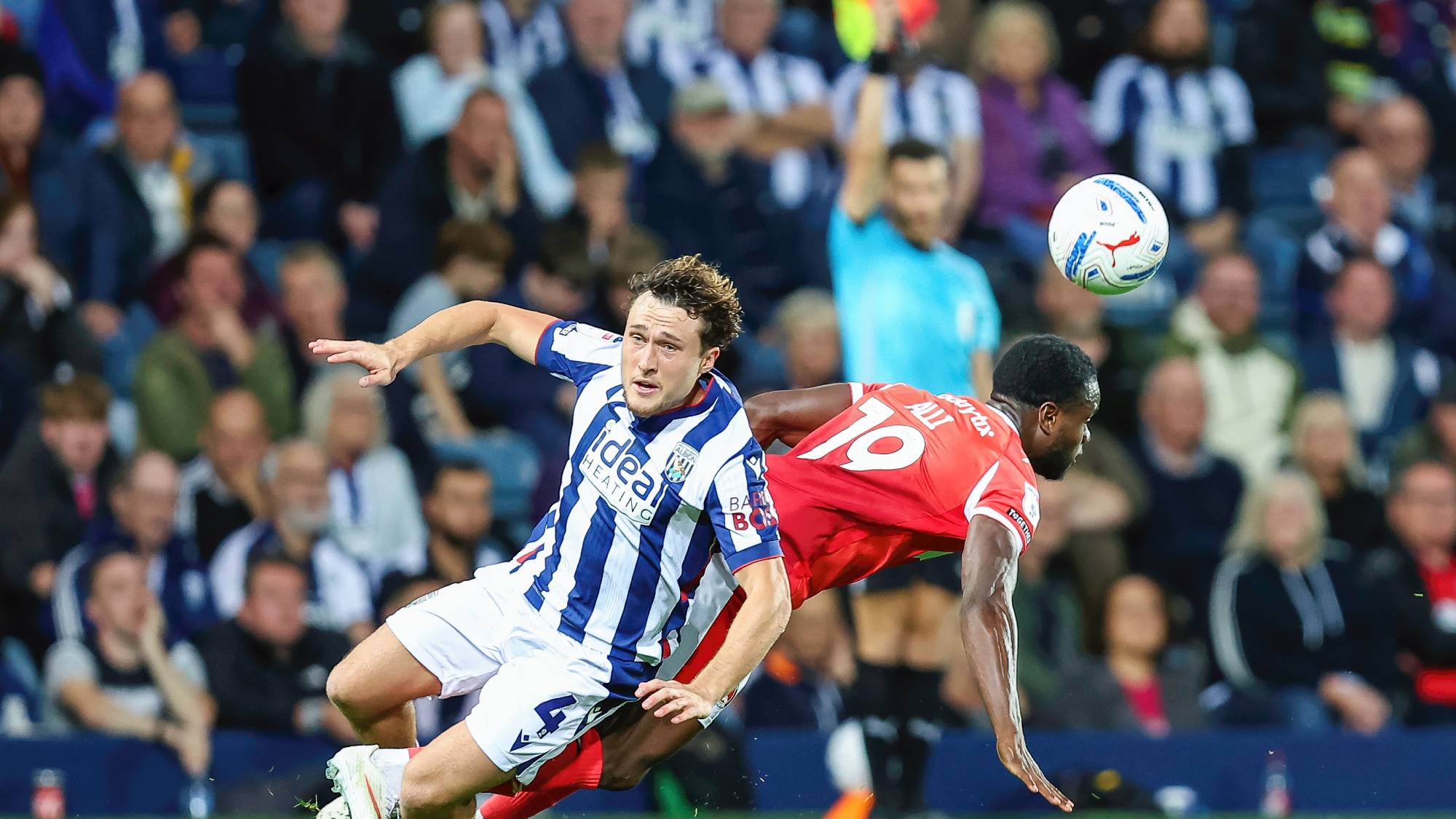West Bromwich Albion #4 Callum Styles and Charlton Athletic #19 Millenic Alli compete for the ball as the linesman raises his flag in the background during the Sky Bet Championship match between West Bromwich Albion and Charlton Athletic at The Hawthorns in West Bromwich, on September 2, 2026. (Photo by Stuart Leggett/MI News/NurPhoto via Getty Images)