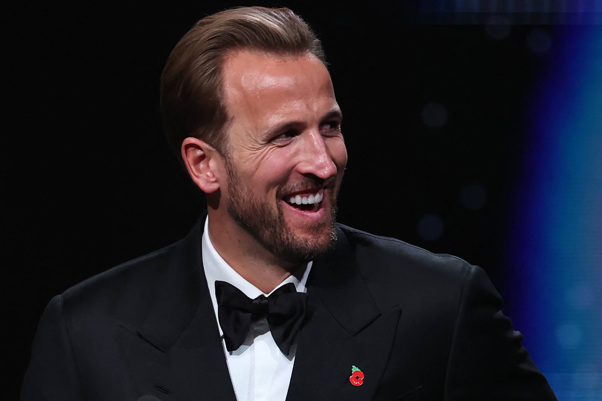 England and Bayern Munich forward Harry Kane smiles after receiving the Ballon d'Or award for the best male footballer during the 2026 Ballon d'Or France Football award ceremony at the Palladium Theatre in London on October 26, 2026.