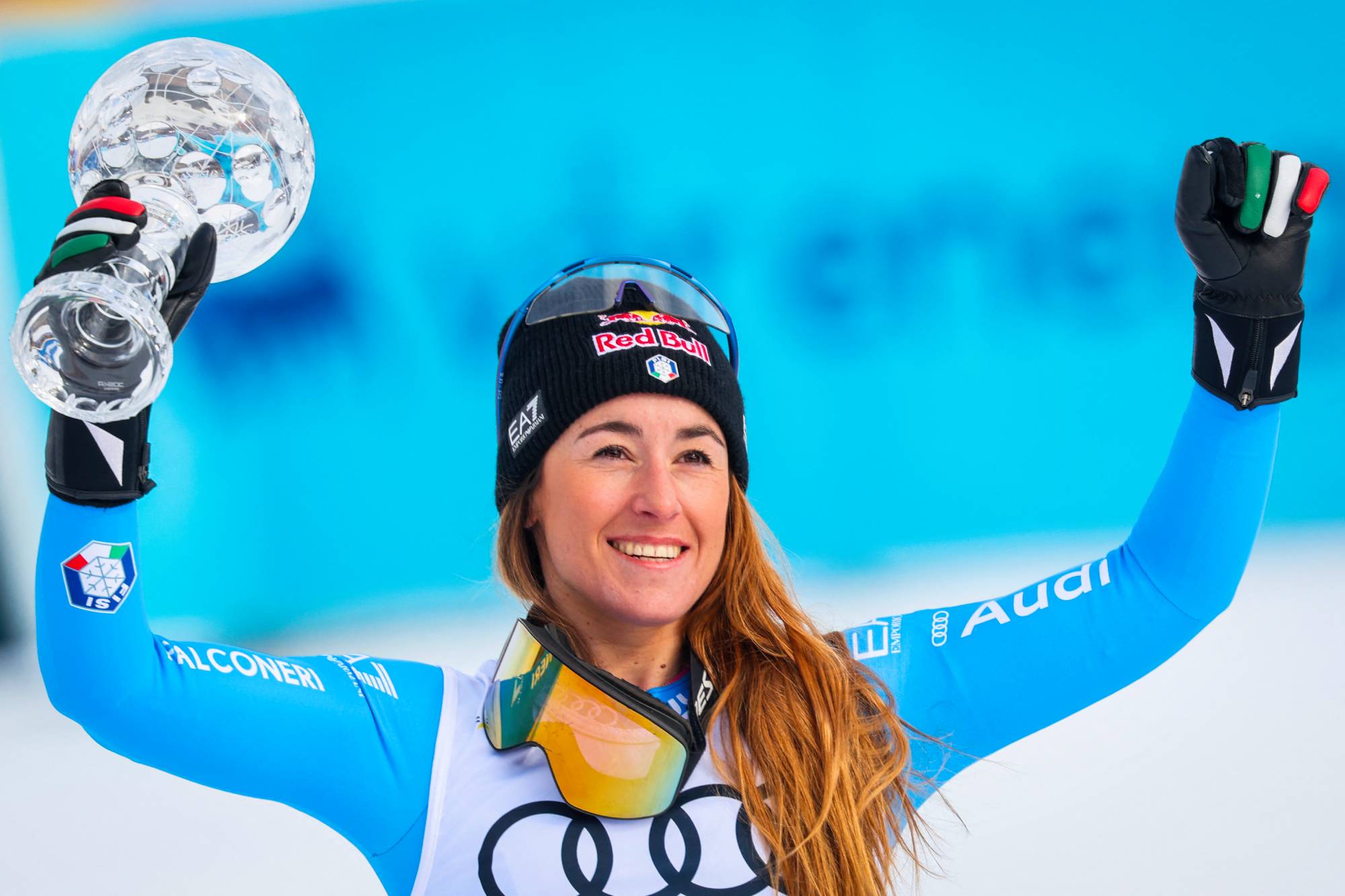 Winner Italy's Sofia Goggia celebrates with the trophy during the podium ceremony after the women's FIS Ski World Cup super-G event in Kvitfjell, near Lillehammer, Norway on March 22, 2026.