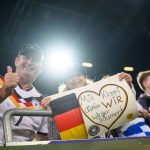 27 September 2026, Bavaria, Augsburg: Soccer, Men: Nations League A, Germany vs. Greece, group stage, Group 2, Matchday 2, WWK-Arena. Before the game, fans hold up a sign that reads, “With Kloppi, we can dream again!” Photo: Tom Weller/dpa