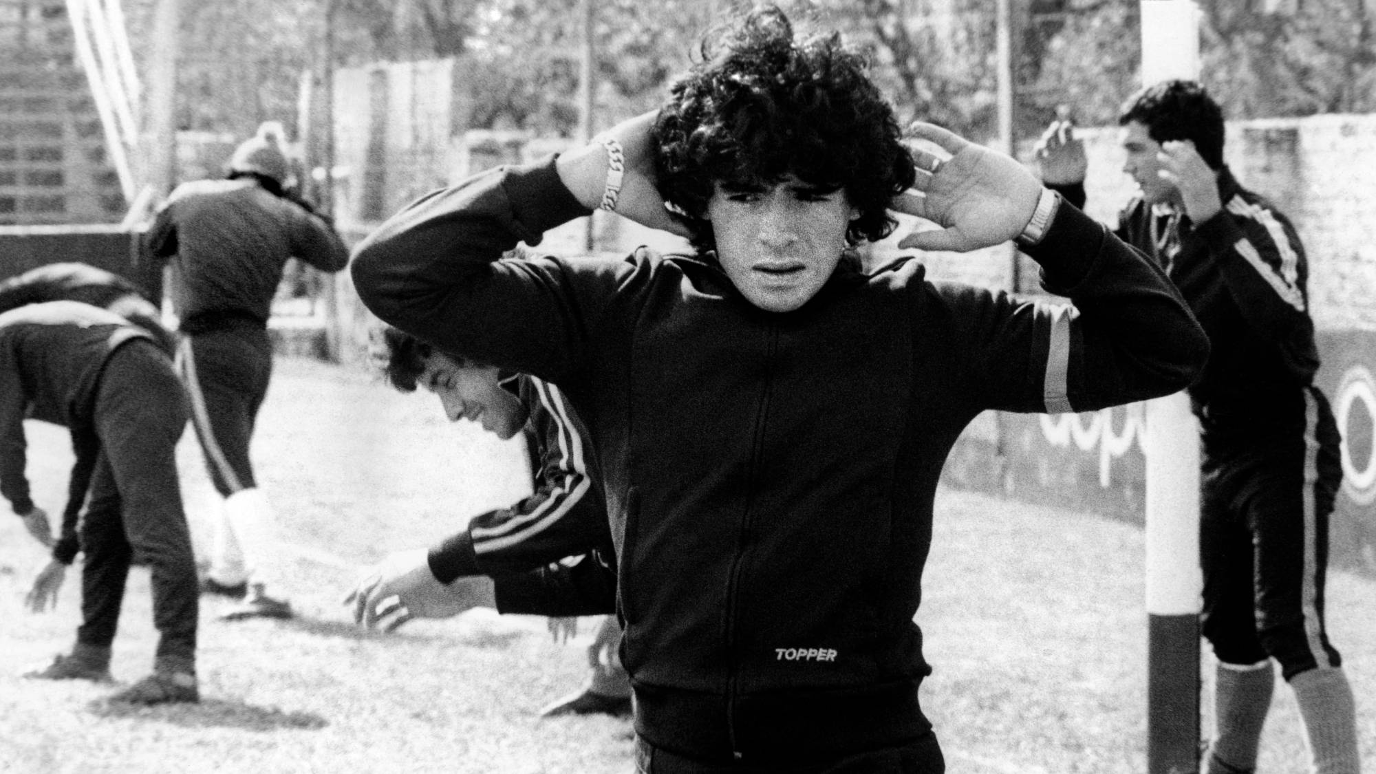 Diego Maradona, 16, warms up on September 12, 1977 in Buenos Aires. Maradona was born on the 30th of October 1960 in Villa Fiorito, one the poorest suburbs of Buenos Aires. Most people consider him as the best soccerplayer ever in the history of soccer. Het started playing when he was 9 years old. His first club was Cebollitas, the youthteam of Argentinos Juniors. Because of his unknown talent he soon got the nickname “Pibe de Oro”, which literally means “Golden Boy”. He played through his 15th for the youthteam. On his 16th he debuted in professional football with Argentinos Juniors. And a few months later he already debuted in the national team of Argentina.